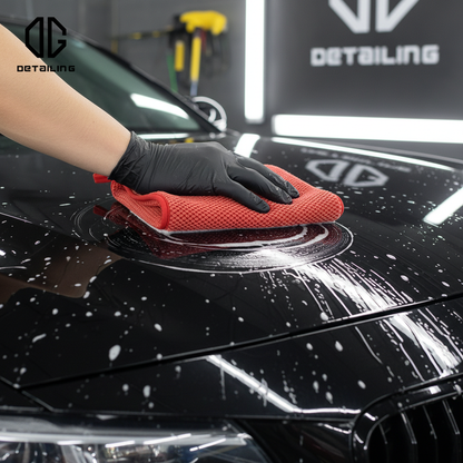 Detailer using clay mitt on paint